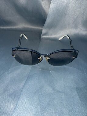 Miu Miu Navy Blue Rimless Oval Sunglasses with Gold Accents